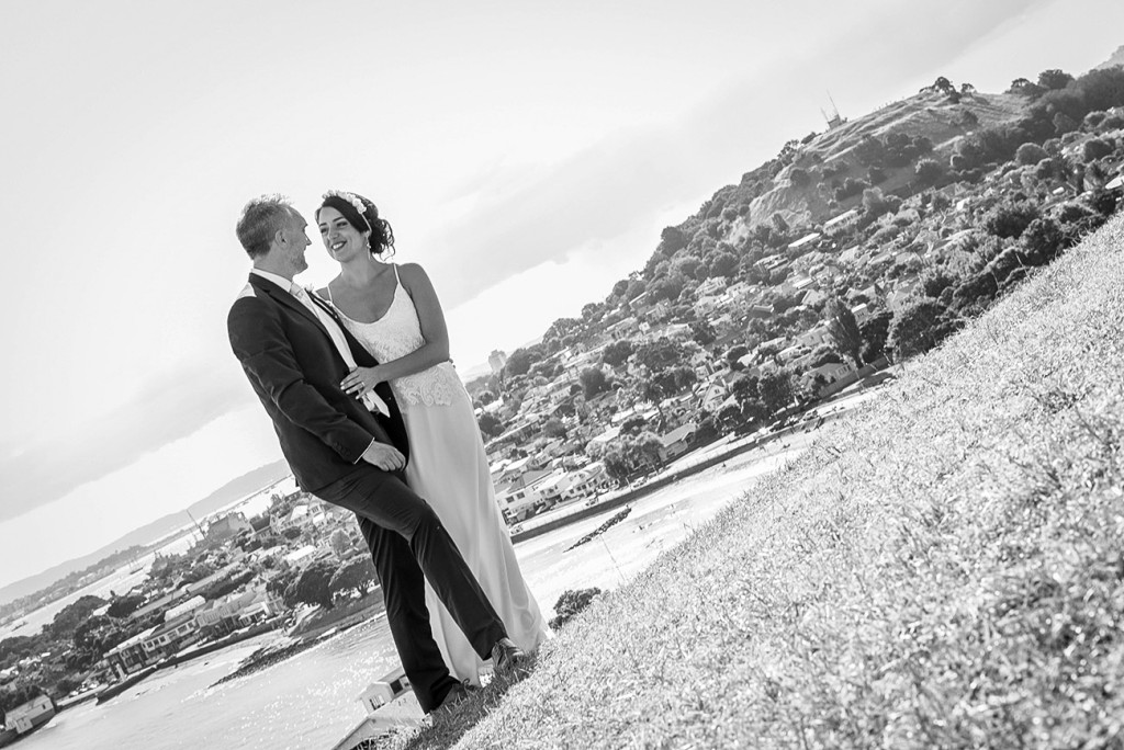 Moment of complicity of the bride and groom in a beautiful landscape