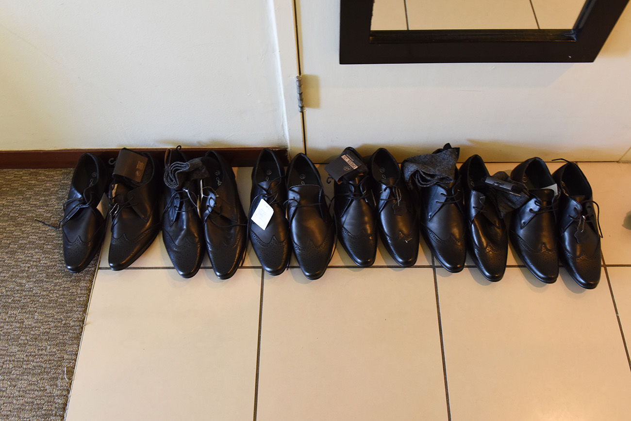 Lining up of the groom and his groomsmen' shoes