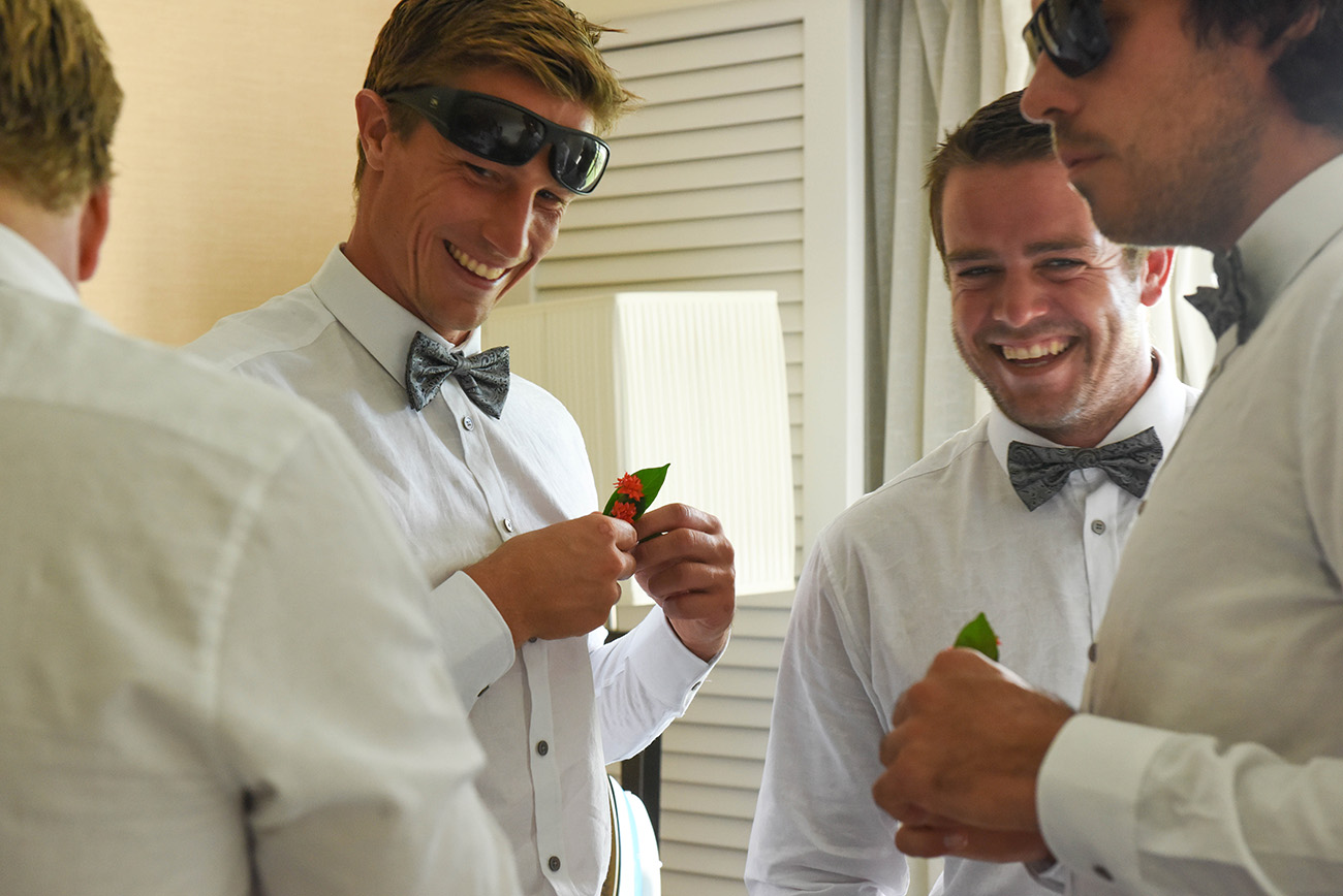 Halfcropped of groomsmen laughing together