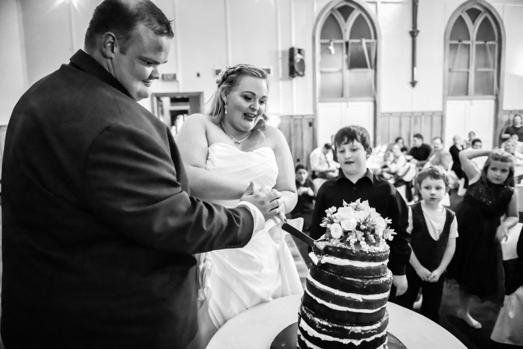 Married couple cut their beautiful wedding cake