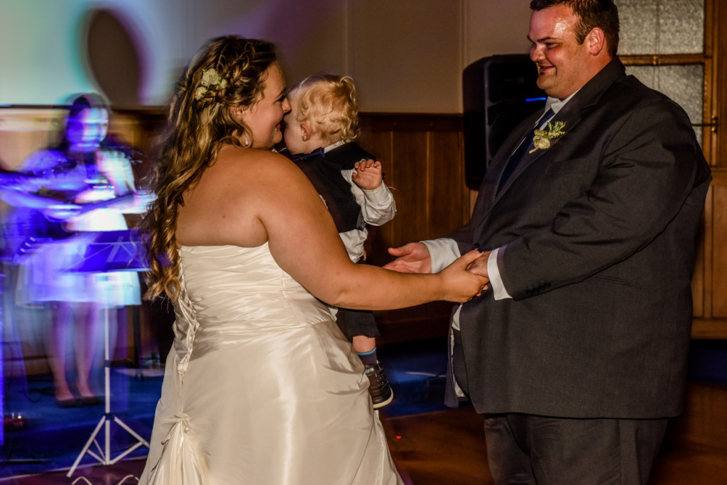 Bride, groom and son share their first dance