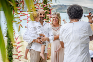 Bride and groom at the altar of their family Beach Wedding on Malolo Island, Plantation Island Resort, Fiji Wedding Photographer