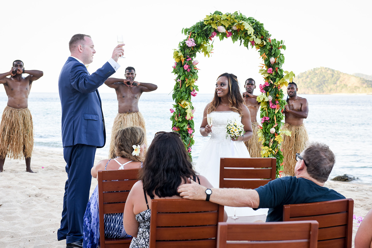 The groomsmen is having a toast to the husband and wife At Paradise Cove Island resort in the Yasawas, Fiji