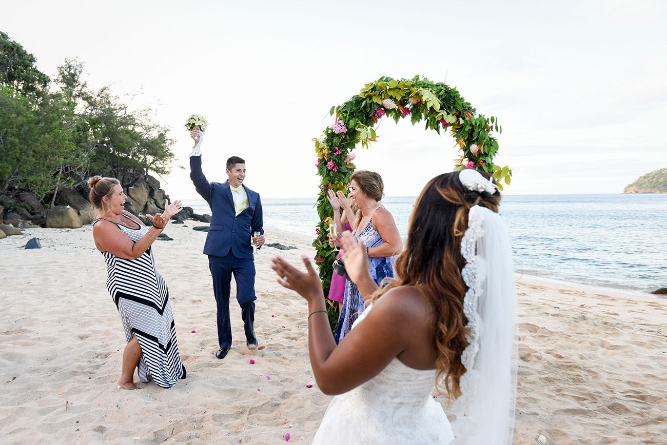 A friend of the bride just grabbed the bouquet At Paradise Cove Island resort in the Yasawas, Fiji