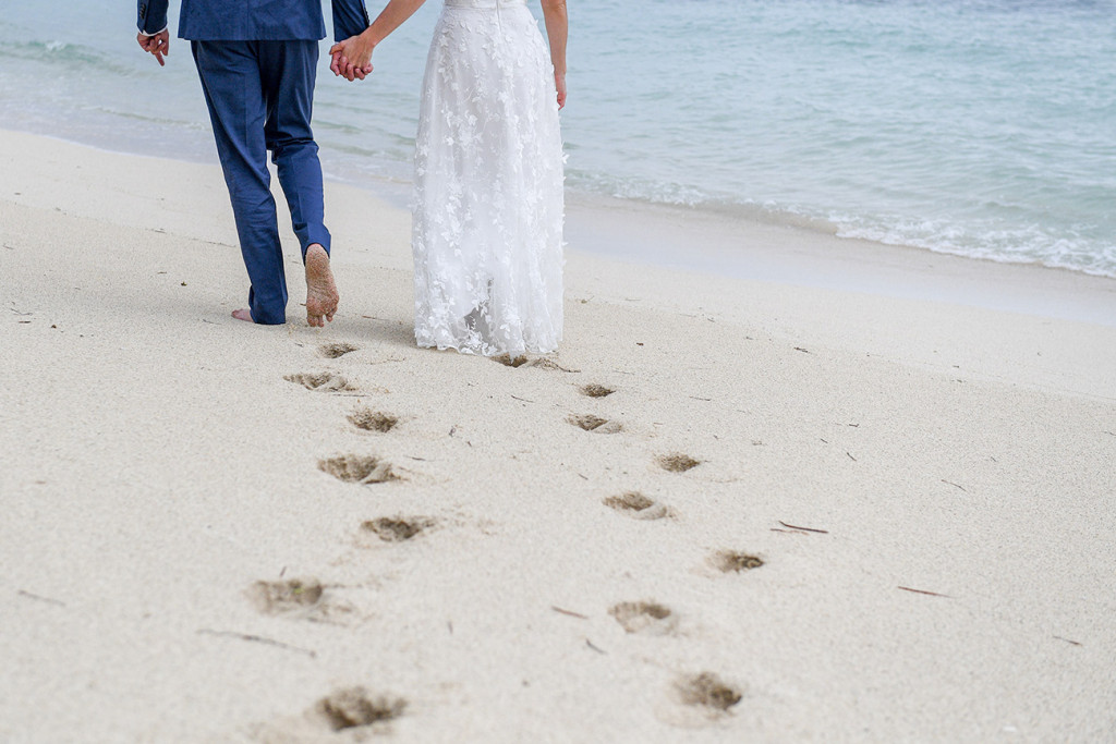 Footprints in the sand in Vomo Island Resort Fiji beach