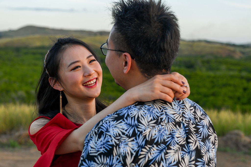 Closeup of young asian couple hugging at engagement photo session in Denarau Island Fiji