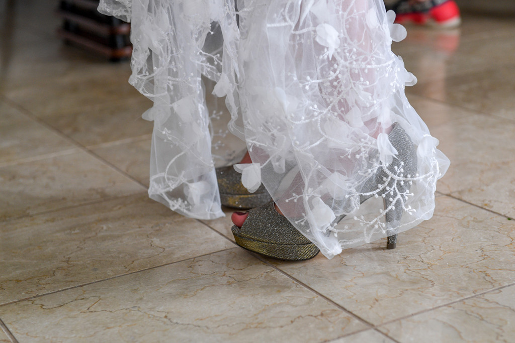 6 inch green heels against lace wedding dress in Fiji wedding