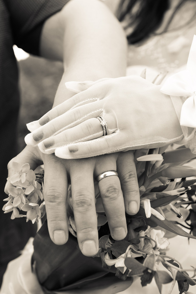 Sepia tone Closeup of bride and groom wedding rings in warwick fiji photoshoot
