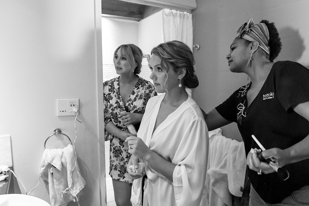 bride looks at herself in the mirror during wedding prep