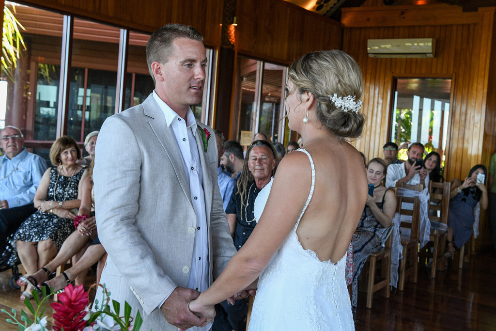 Groom says his vows to bride at the altar in Outrigger Fiji wedding