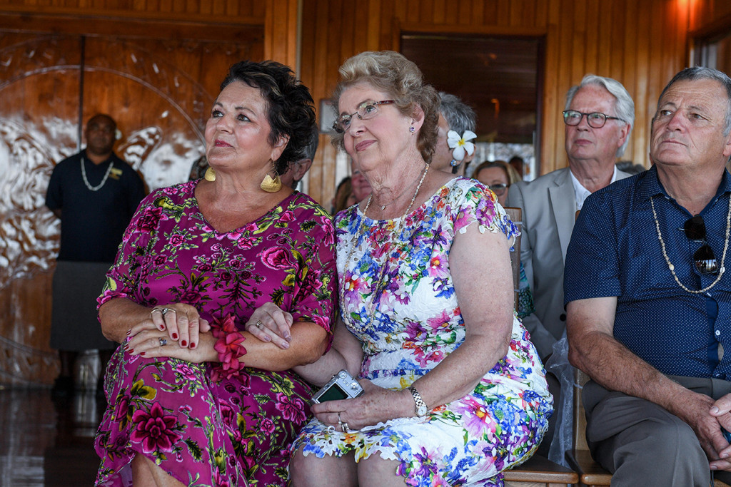 Mom and mom watch as their children present vows in The Outrigger wedding