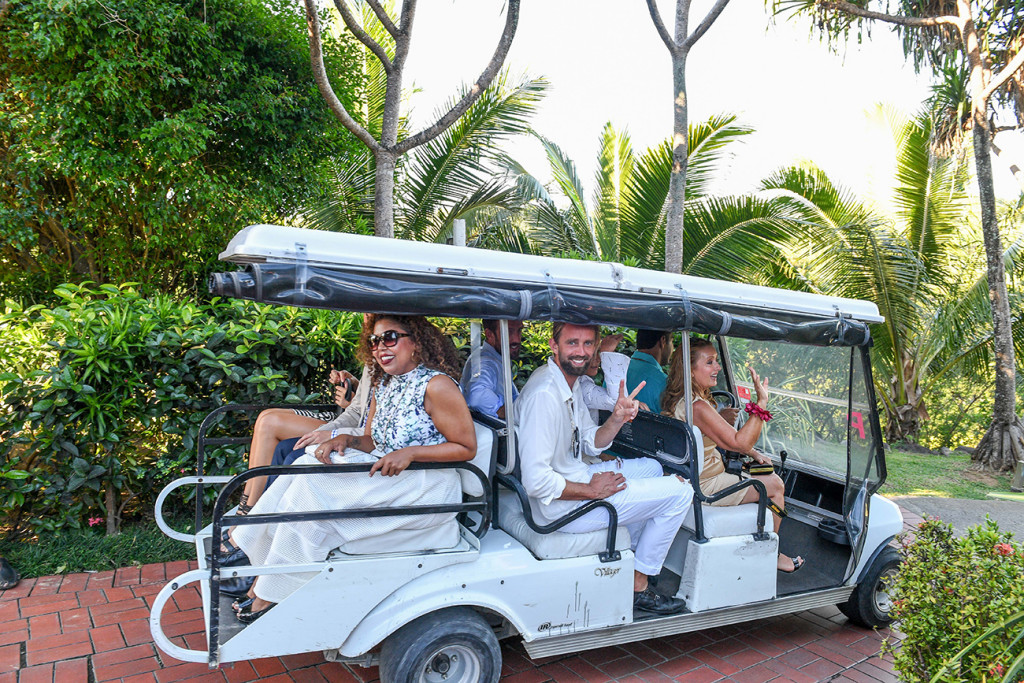 Wedding guests transported to reception in golf carts