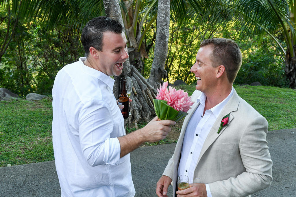 Groomsman joke feeds the groom a tropical flower bouquet