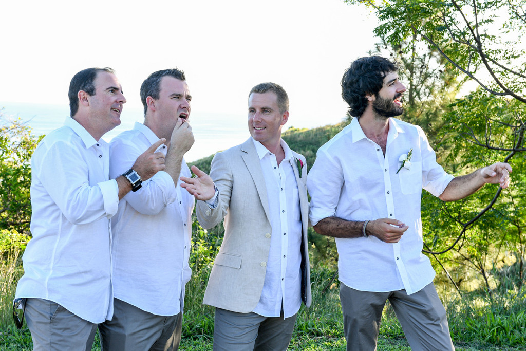 Groomsmen make goofy faces at Fiji Outrigger wedding