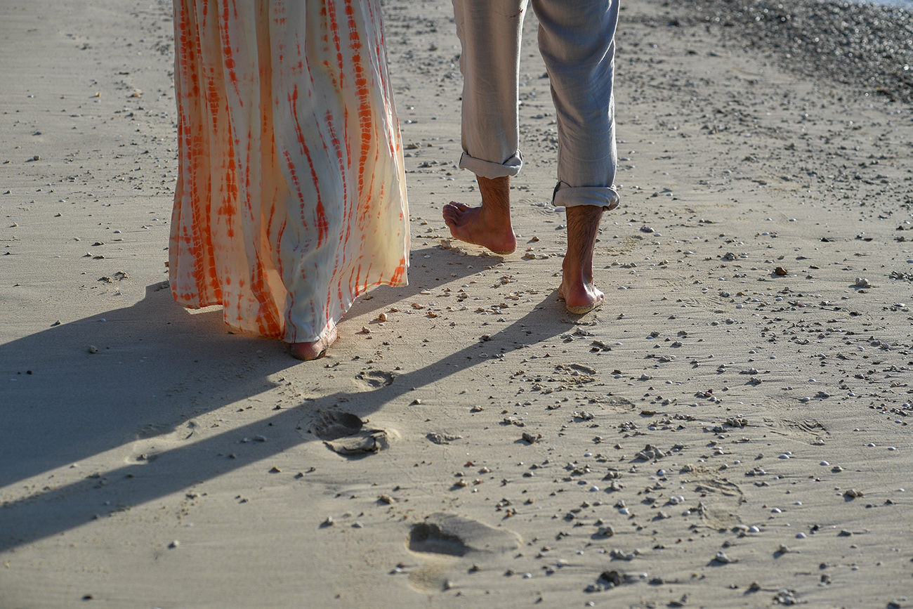 Footprints in the sand of Newly wed couple