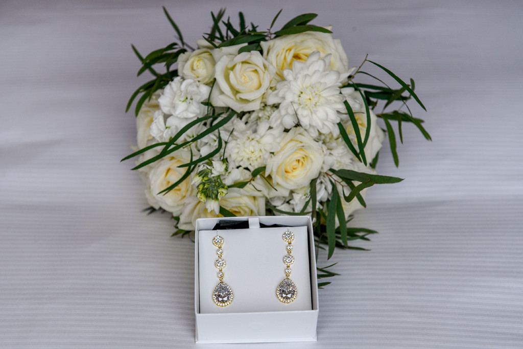 Stunning gold and paua earrings at Auckland wedding