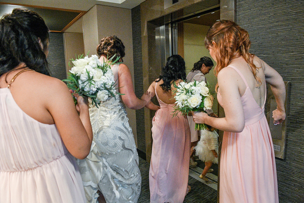 Bride and bridesmaids making way into the venue