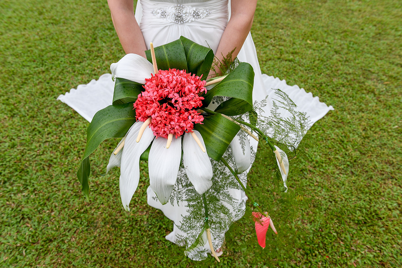 Closeup of bride's enormous crimson native Fiji flower bouqet