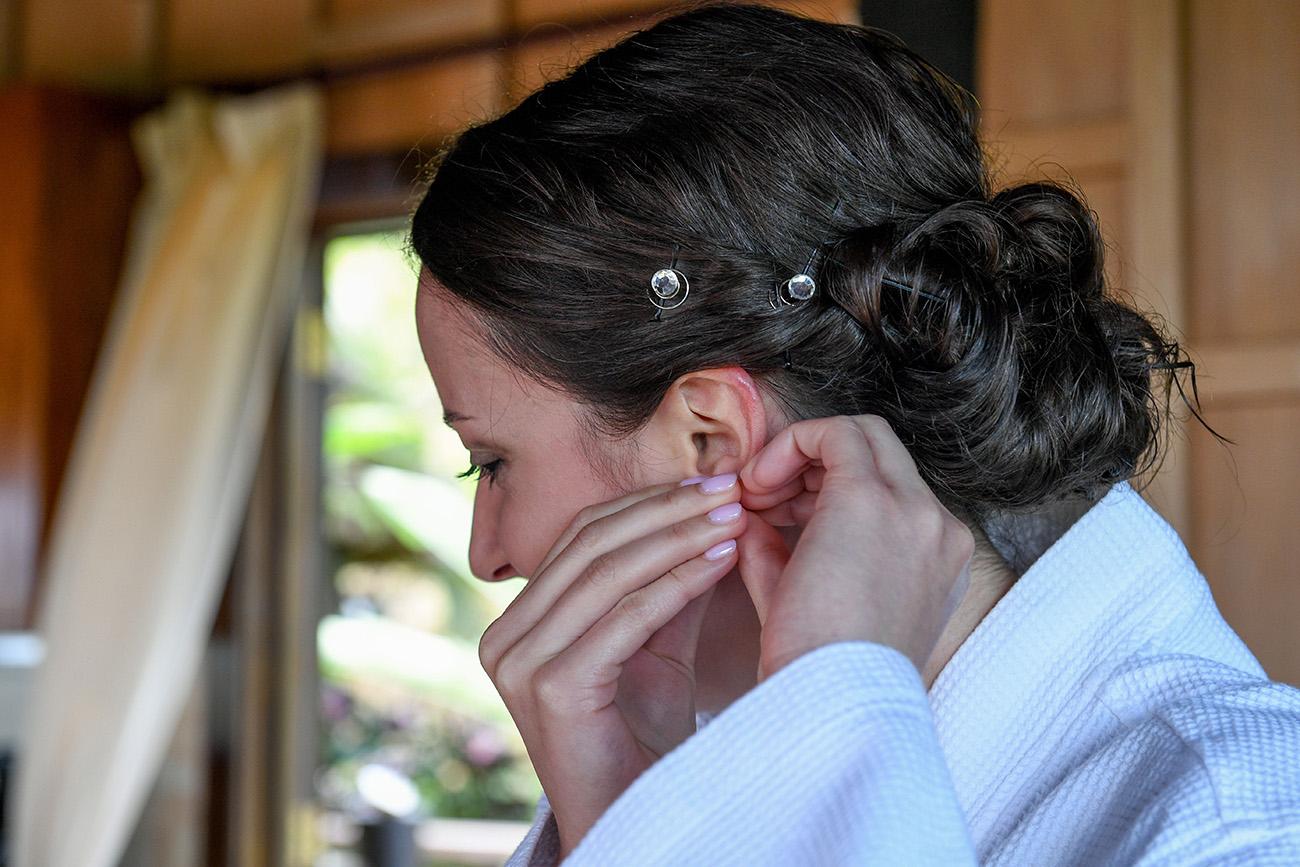 Closeup of the bride wearing earrings
