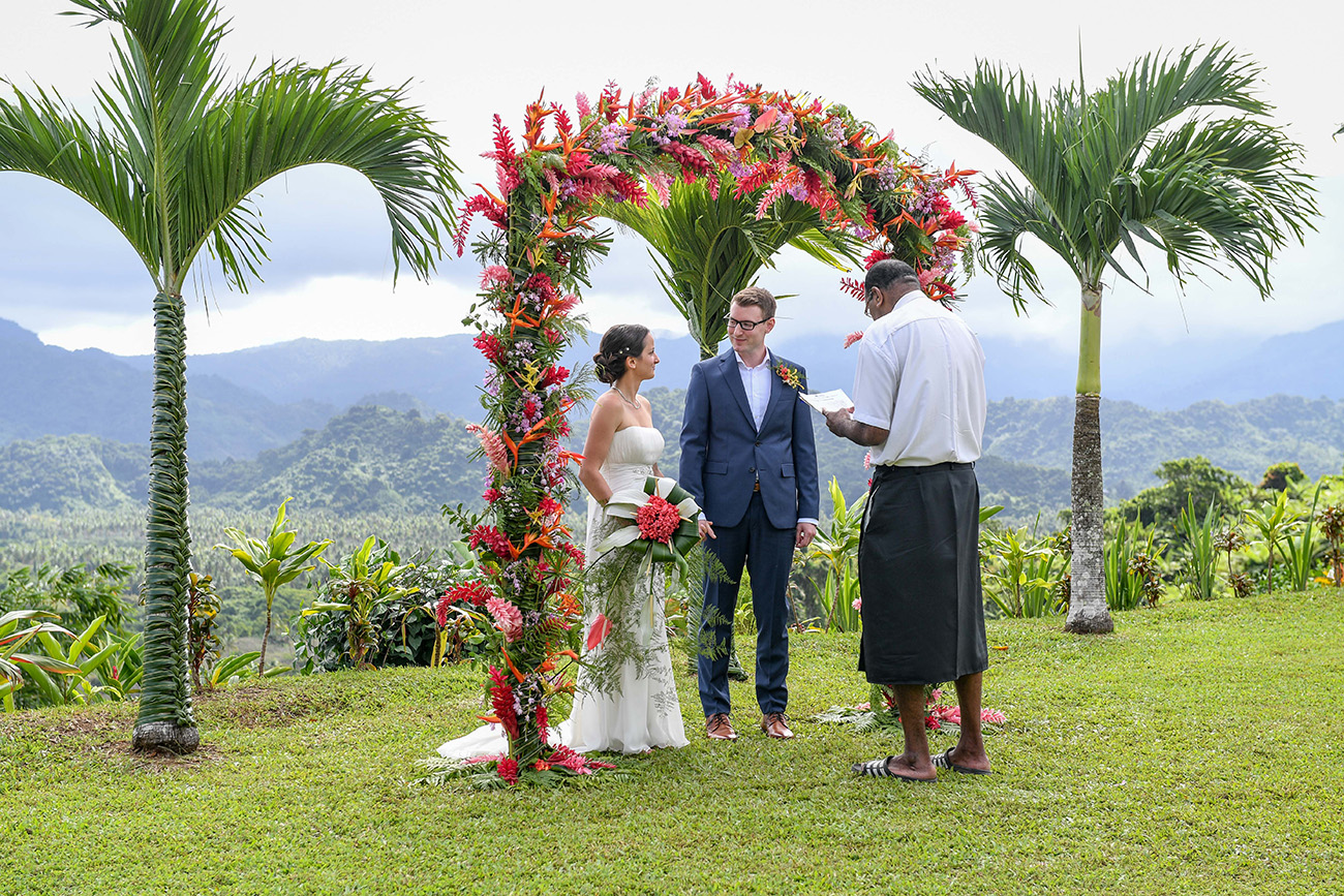 Bride and groom stand at the altar as the Fiji celebrant officiates the wedding at Emaho resort in Savusavu, Fiji