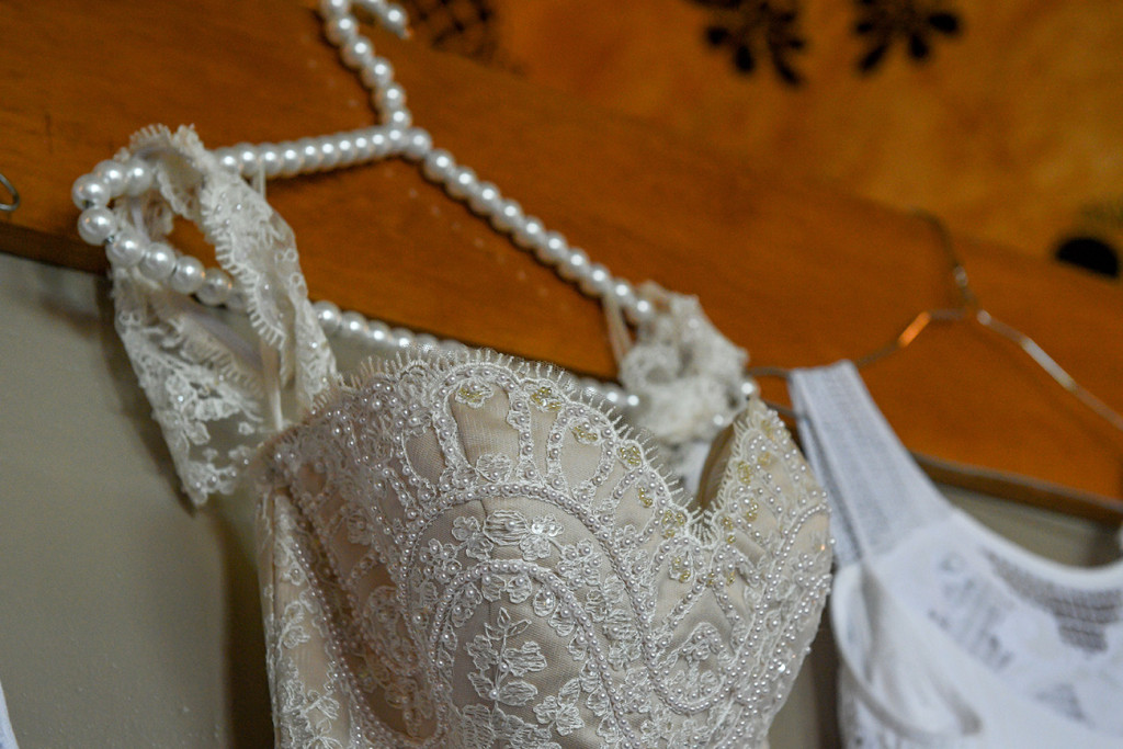 Pearl necklace and beige bohemian wedding dress Fiji