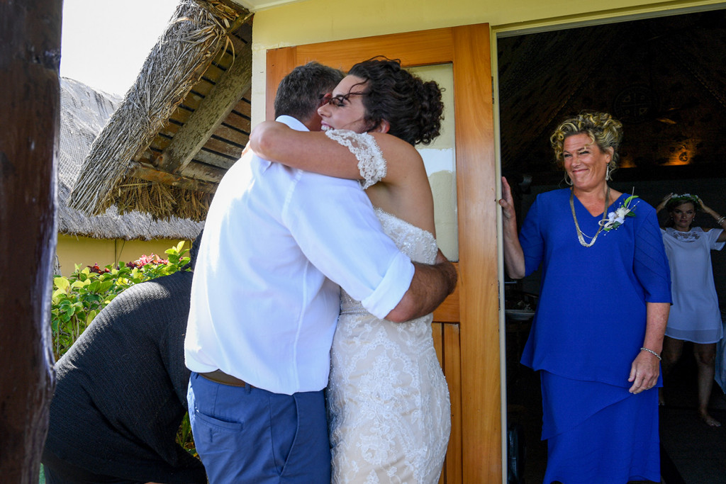 Bride hugs her dad before her bohemian wedding