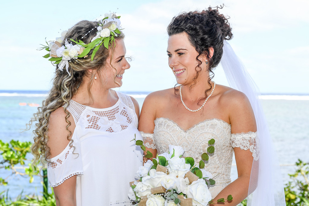 Stunning bride and bridesmaid at the altar at the wedding in Outrigger