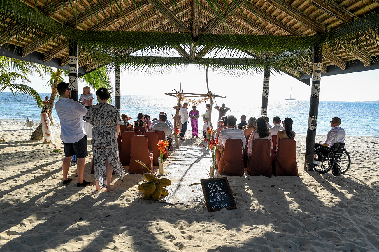 Outdoor traditional Fiji beach wedding ceremony at the Plantation Island Resort