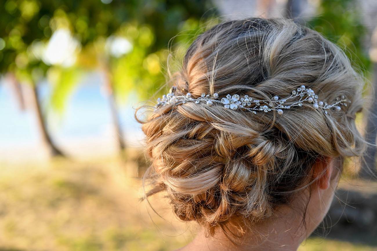 Pearl and flower tiara detail on the bride's hair