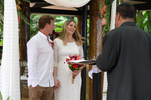 Bride smiling at the celebrant for her elopement at the Warwick, Fiji