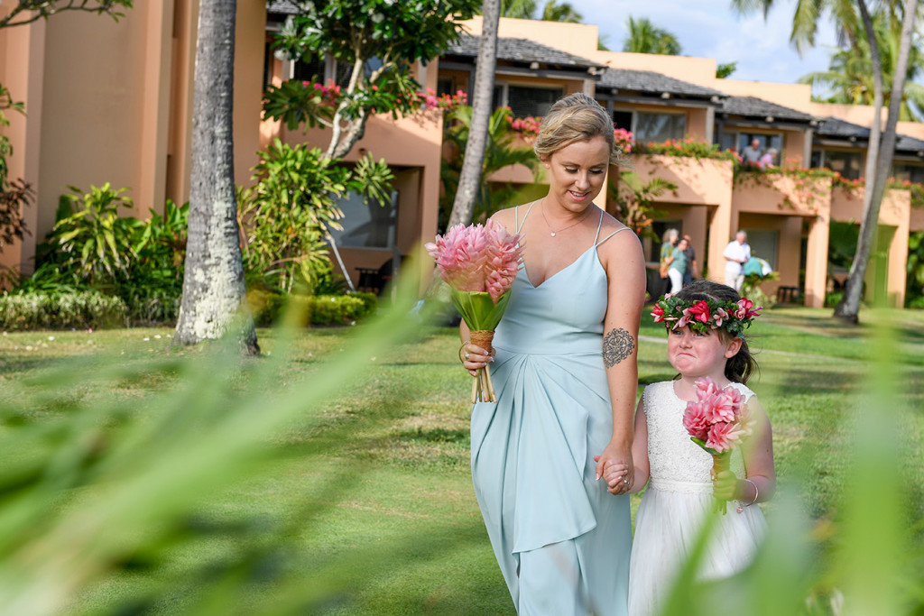 Bridesmaid in stunning baby blue dress walking down the aisle