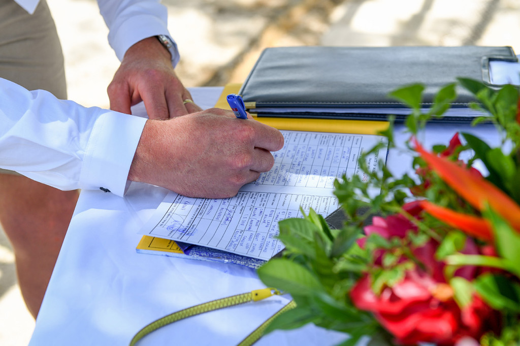 Groom signing his wedding certificate
