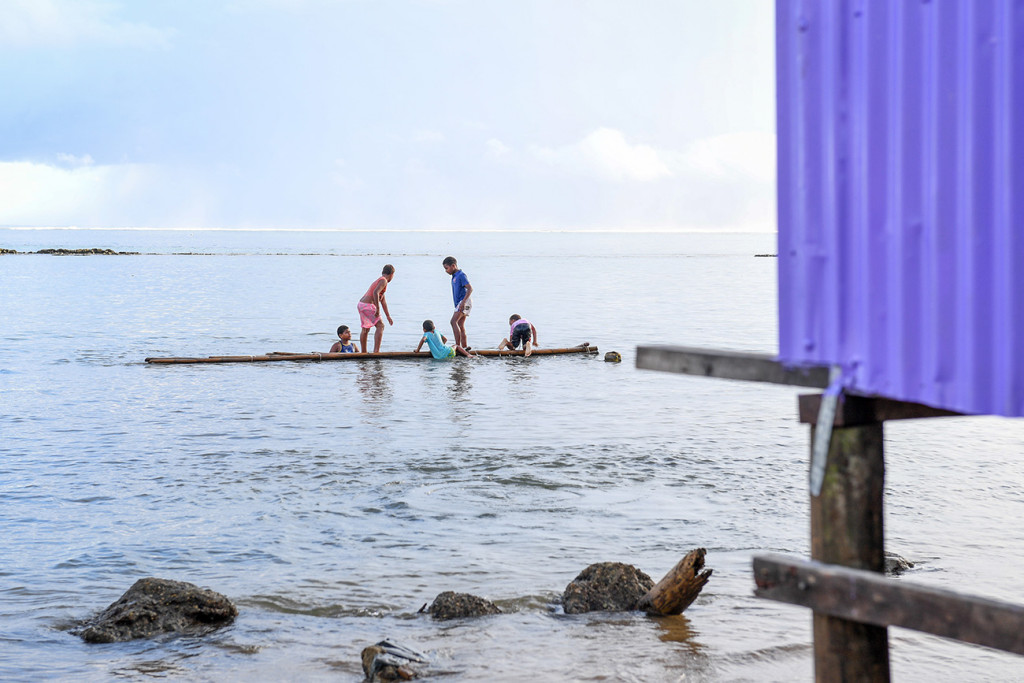 Children playing on the beach at Naviti Resort Fiji
