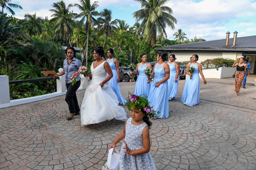 Bride and her bridesmaids dance to the wedding venue