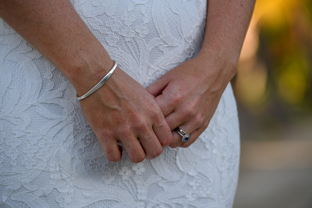Simple custom made stainless steel jewellery on bride's hands