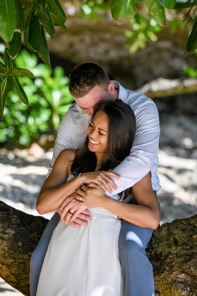 The newly-weds share a light moment while cuddled under a tree at Savasi