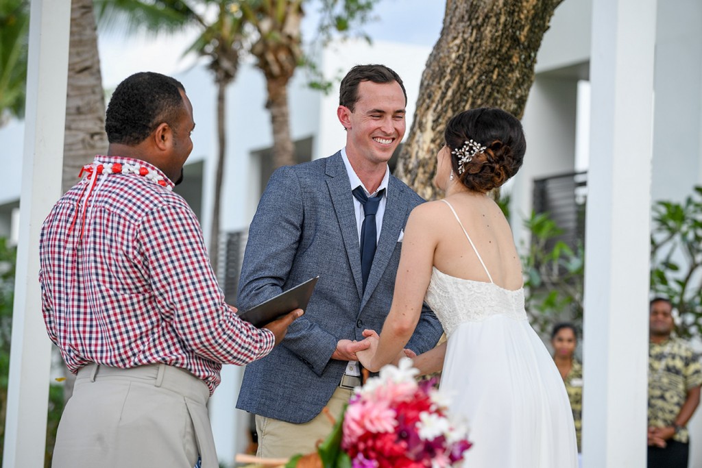 The groom has a light moment while sharing his vows