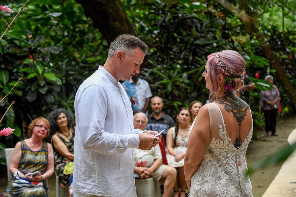 The groom reads his vows to his bride