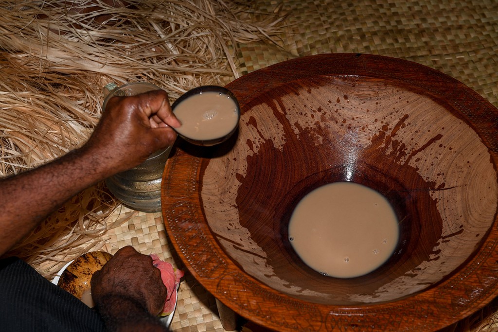 Wedding tea is fetched in a traditional wooden Fiji pot