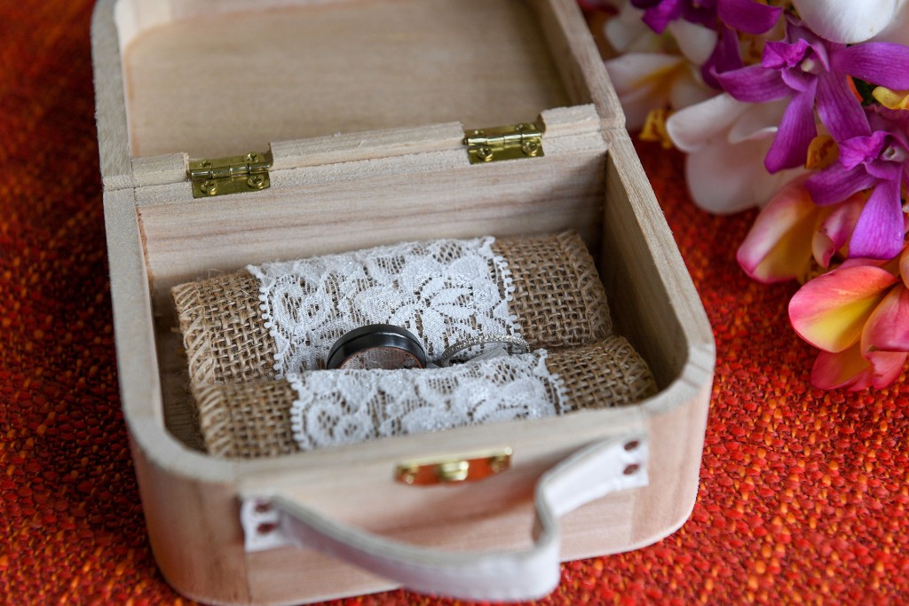 The silver rings are delicately nested in a lace mat