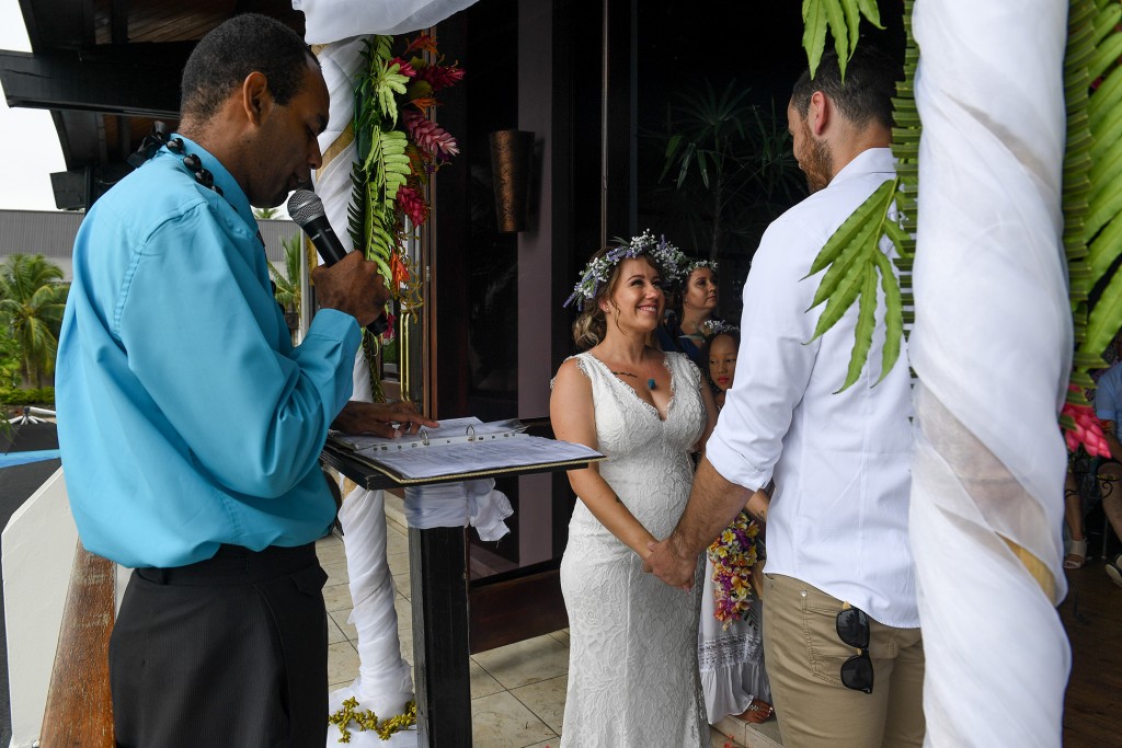 The celebrant officiates the vow exchange ceremony