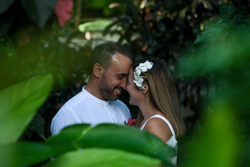 An intimate moment of the married couple in the forest is captured