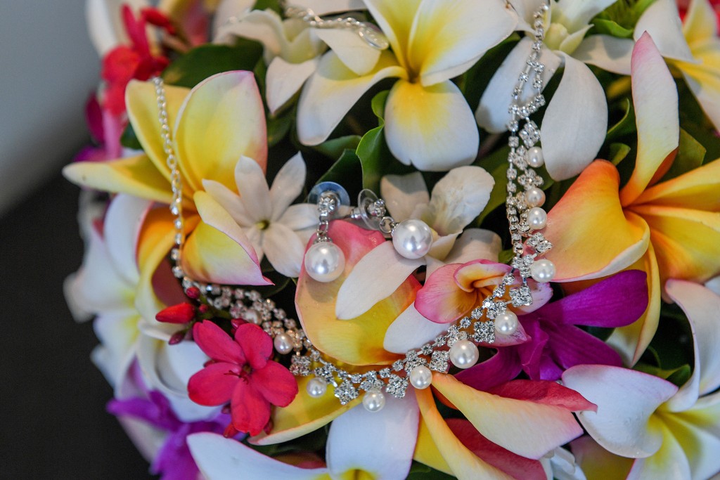 Small pearl earrings nested in a Tropical Fiji flower bouquet