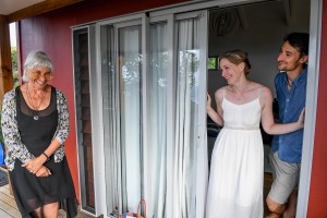 The married couple stand in the doorway as they prepare to go get married