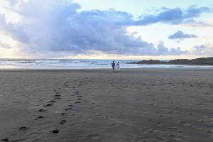 The newly weds stroll on black sand beaches