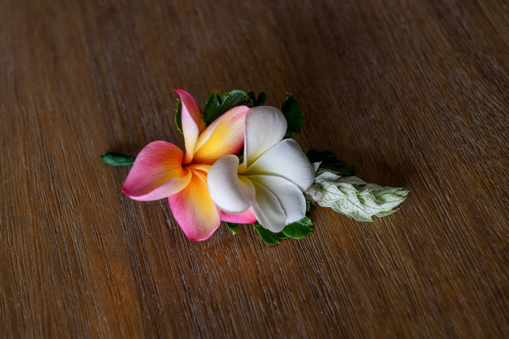 A fresh flower frangipani boutonniere 