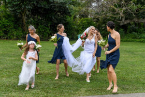 The bride dances with her bridesmaids as they head for the wedding ceremony