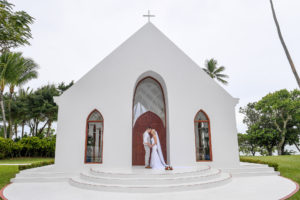 The newly weds pose in front of the magnificent white chapel at Shangri La Fiji