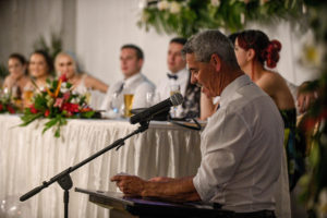 The bride's dad reads a speech to the newly weds