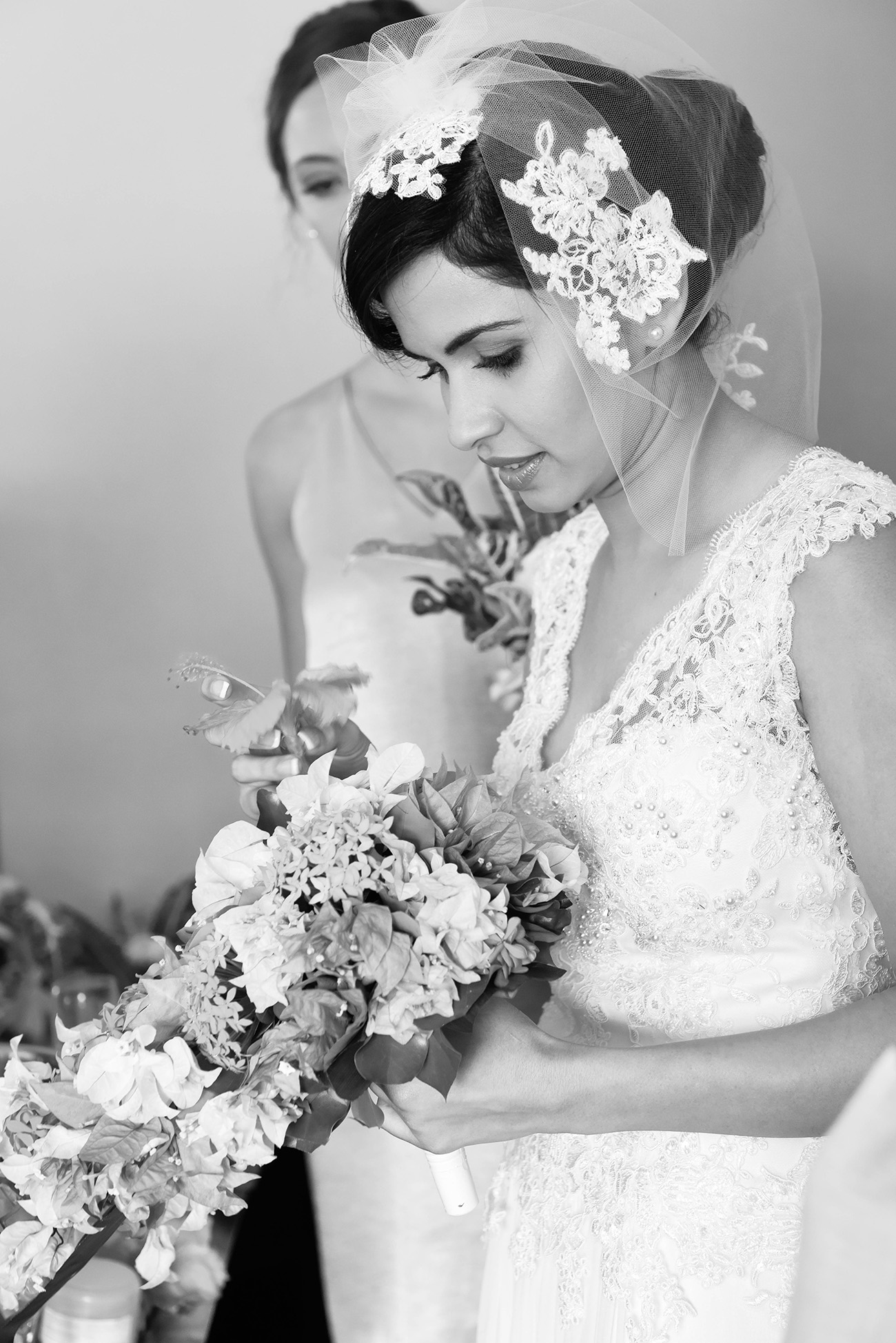 Black and white bride's profile holding her wedding bouquet